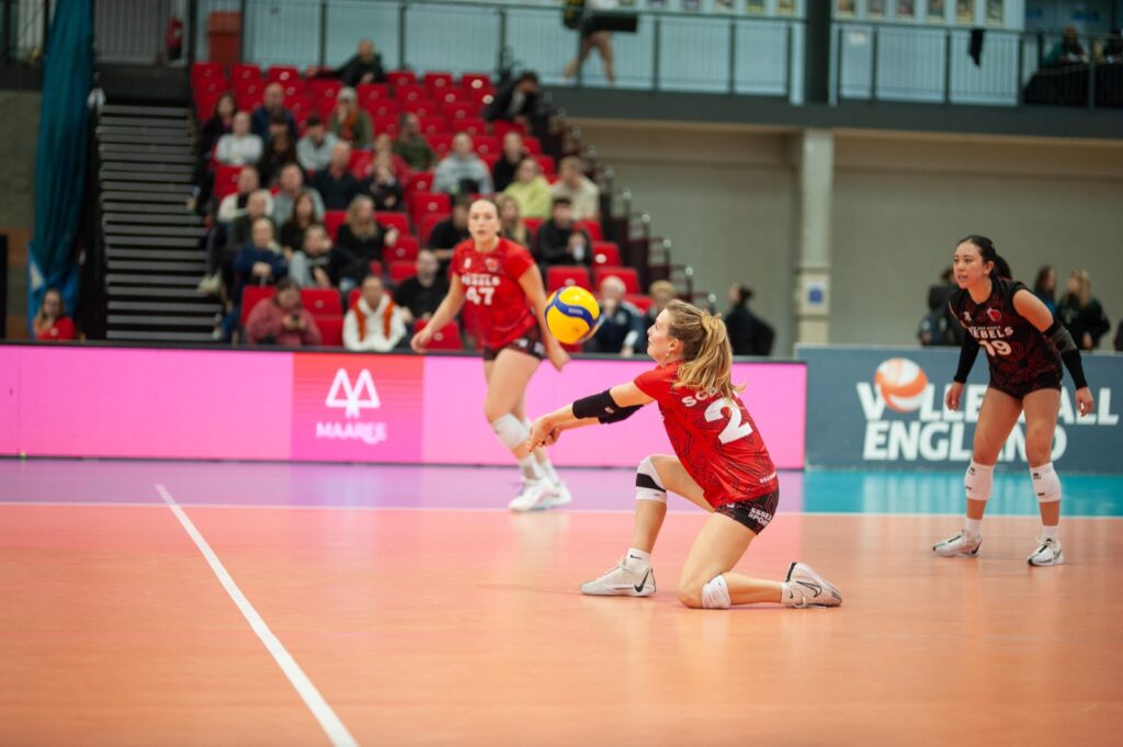 Rebels player digging shot by Nathaniel MacRae Photography
