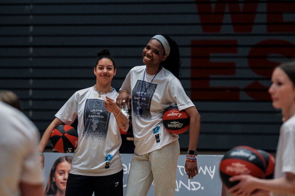 Essex Rebels Women Daniella Turner and Brooke Flowers helping out at the clinic posing for a picture